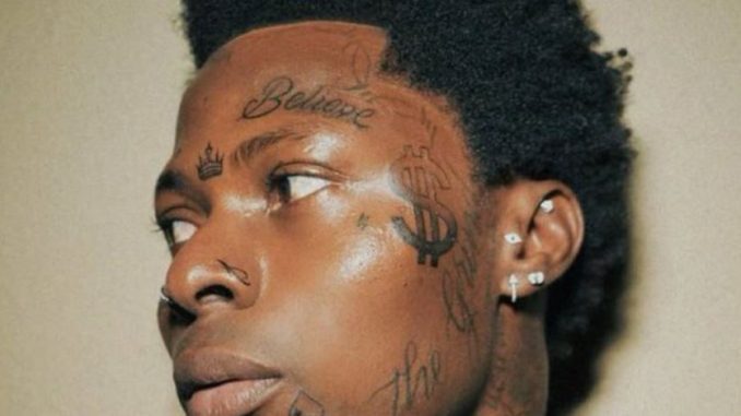 Asake face tatts